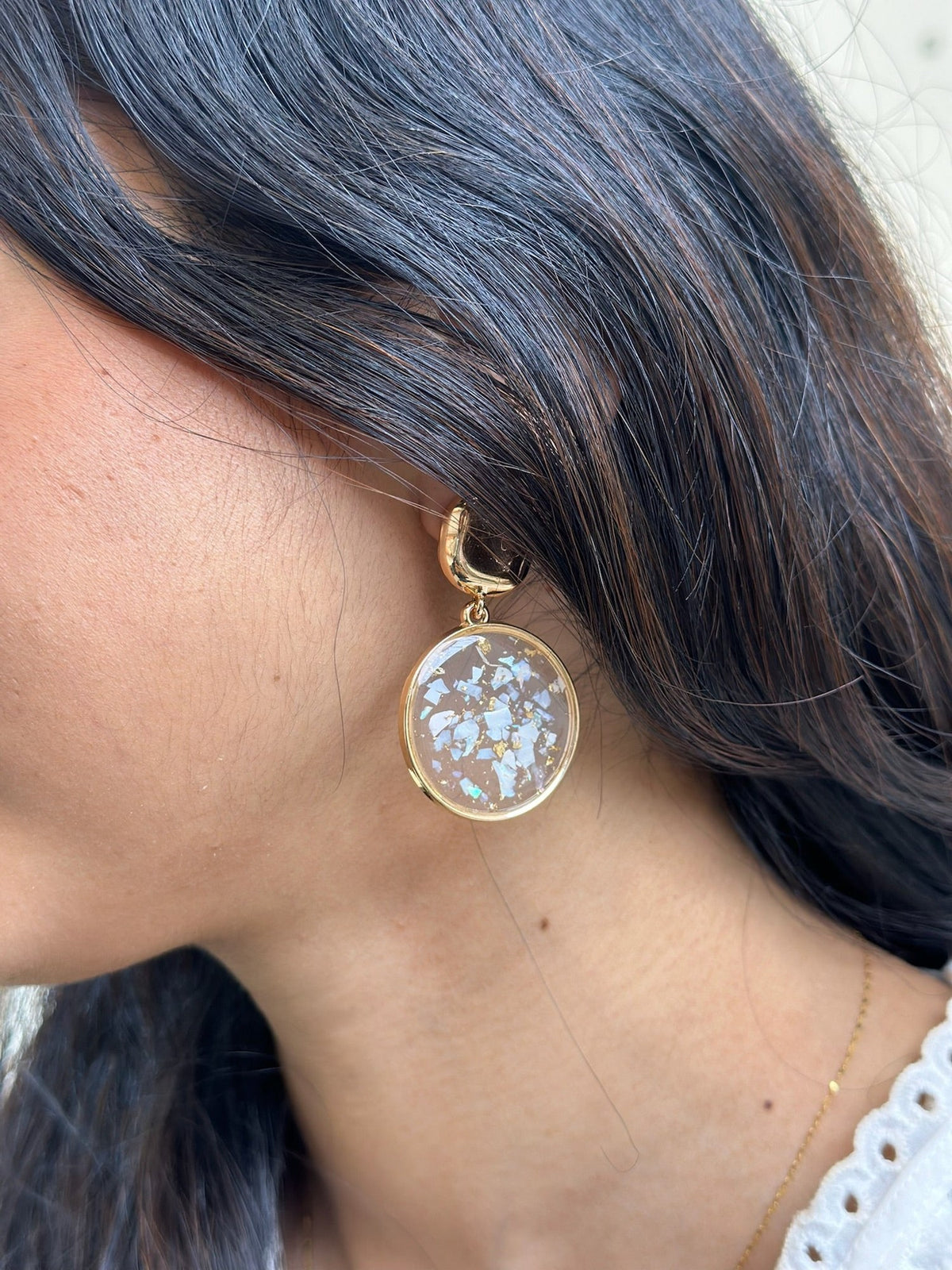 Paired jewellery worn: earrings glass petal