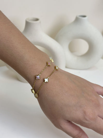 Paired Clover Petite Bracelet in gold-tone, two bracelets worn together on the wrist with clover-shaped motifs