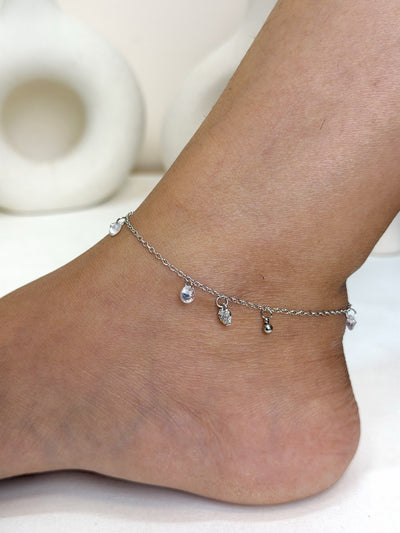 Paired Lunelle Anklet in silver-tone, worn on the ankle with a dainty chain and clear drop stones